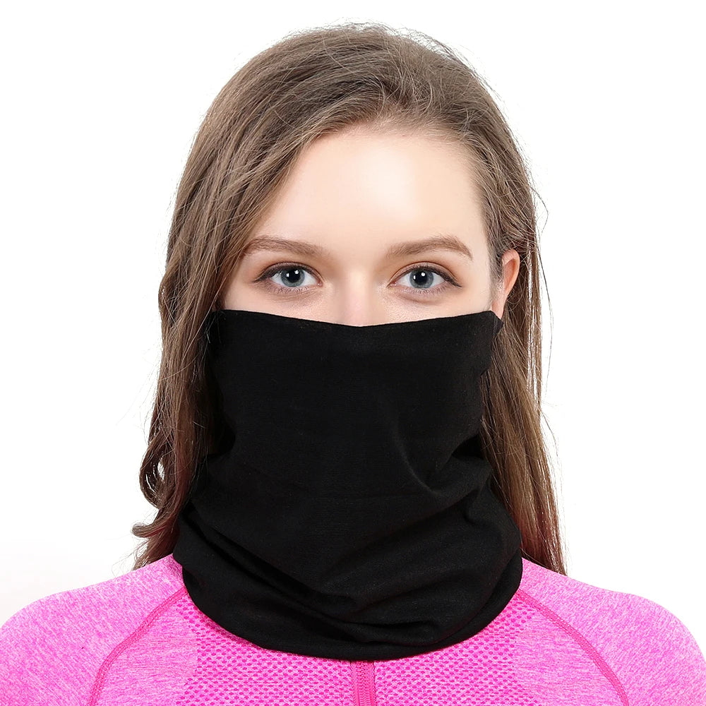A woman wearing a black seamless fabric balaclava or neck gaiter against a white background.