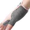 A hand wearing a gray half-finger sports glove for weight lifting and exercise.