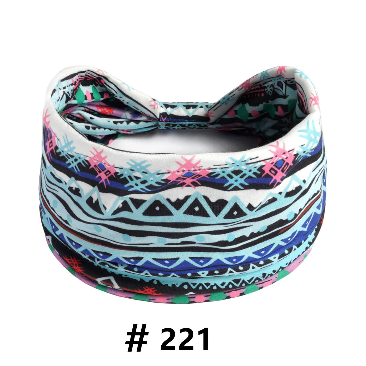 A colorful boho cotton turban headband with geometric patterns in pink, blue, black, and white.