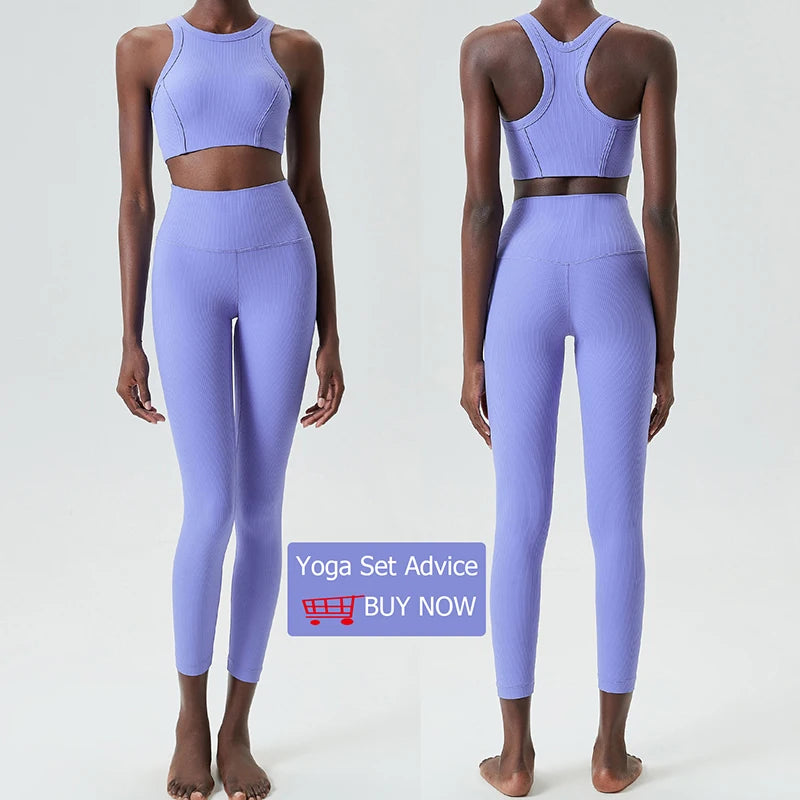 A model is shown wearing a lavender high-impact stretch yoga set consisting of a crop top and leggings.
