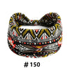 A black and yellow patterned boho cotton turban headband for workout or yoga.