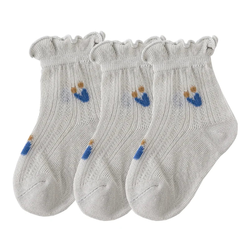A pack of three light gray thin summer casual baby socks for kids