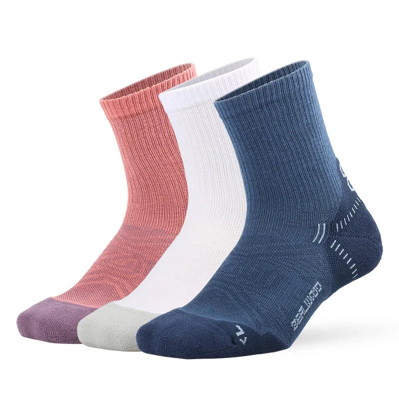 A stack of breathable performance running socks in various shades of pink, white, and blue.