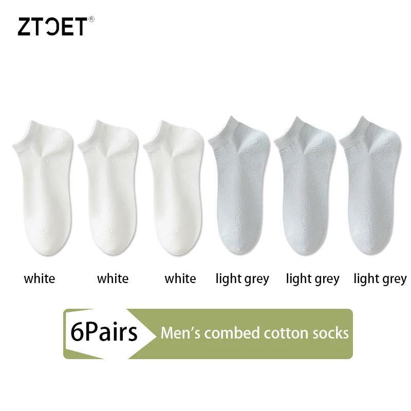 A set of six pairs of men's combed cotton socks in white and light grey colors.