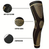A black compression sleeve for the leg featuring copper fabric and anti-slip silicone grips.