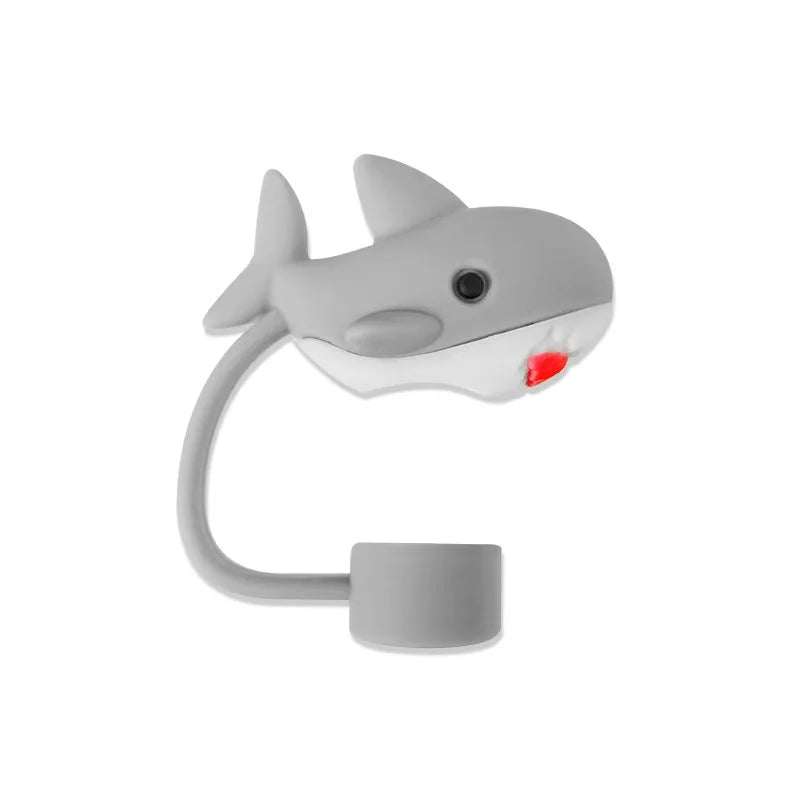 A gray silicone straw cover shaped like a fish, used to cover tumblers and water bottles.