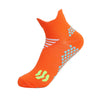 Orange running socks with white and light blue patterned accents