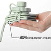 A hand holds a light green collapsible silicone sports water bottle, demonstrating an 80% reduction in volume.