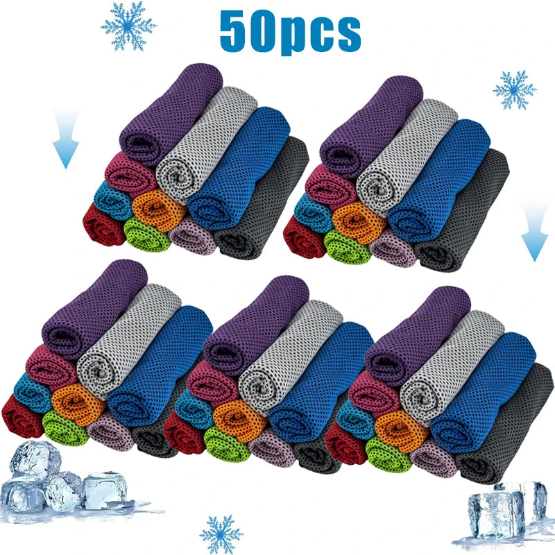 A collection of 50 purple, gray, and blue cooling microfiber towels arranged in rows with ice cubes.