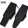 Two pairs of black men's ice silk performance pants shown flat
