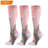 Three pairs of pink compression socks for men in various shades and patterns.