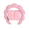Pink microfiber skincare headband and wristband set with a floral design