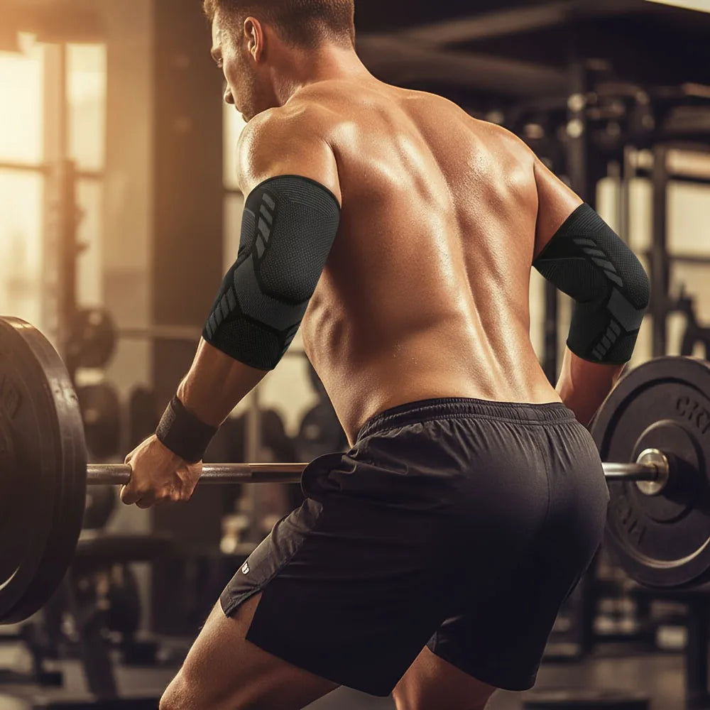 A muscular man performing a workout exercise while wearing black breathable stretchy elbow support sleeves.