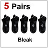 Five pairs of black athletic socks are displayed for sale.