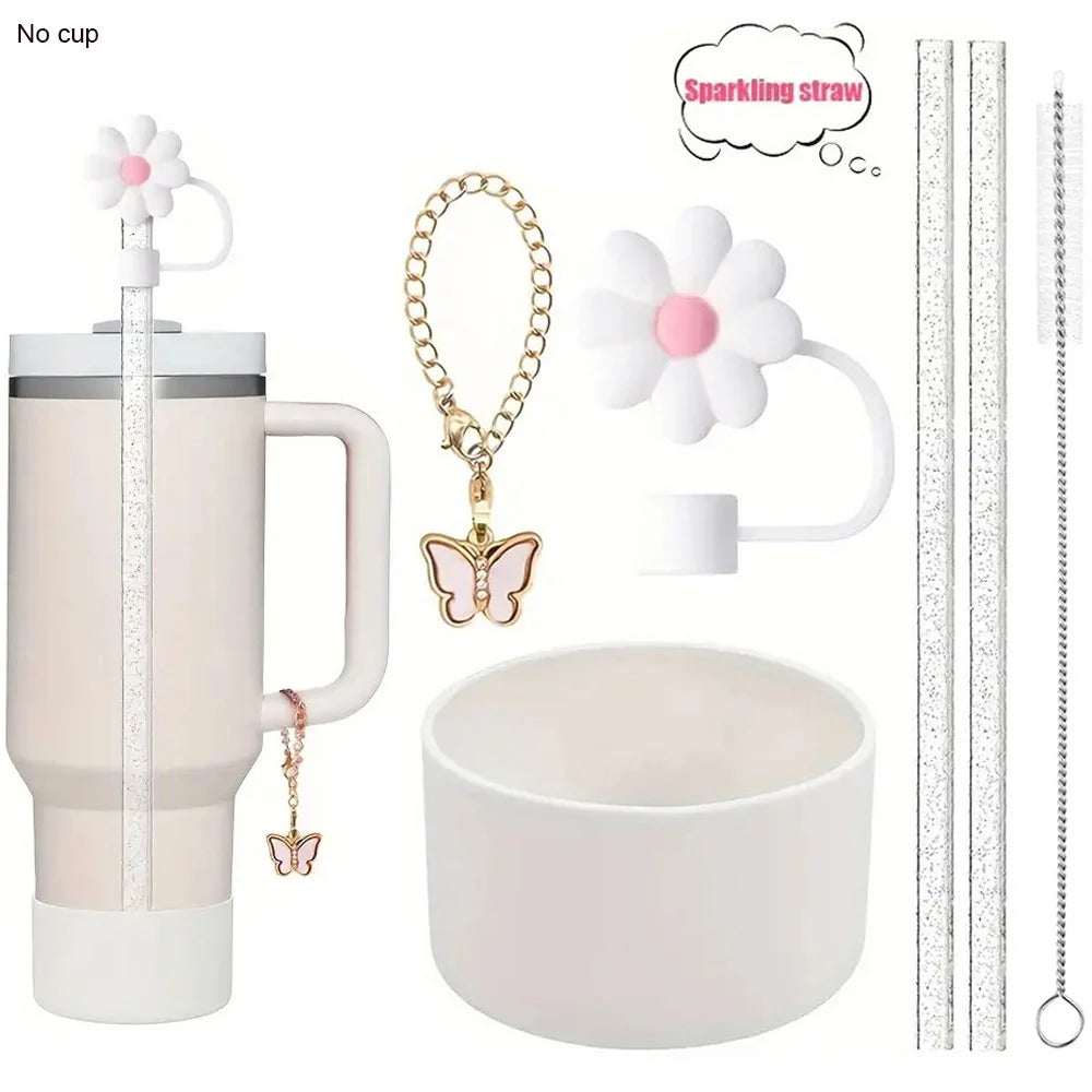 A set of six reusable accessories for a tumbler, including a sparkling straw, flower charms, and cleaning tools.