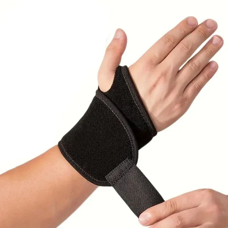 A hand wearing a black adjustable wrist support brace for pain relief.