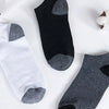 A set of ten ankle socks in black, white, and gray patterns displayed on a white background.