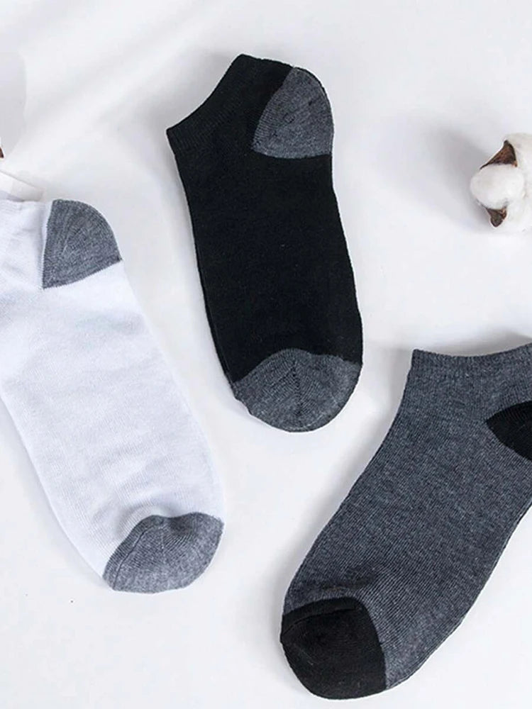 A set of ten ankle socks in black, white, and gray patterns displayed on a white background.