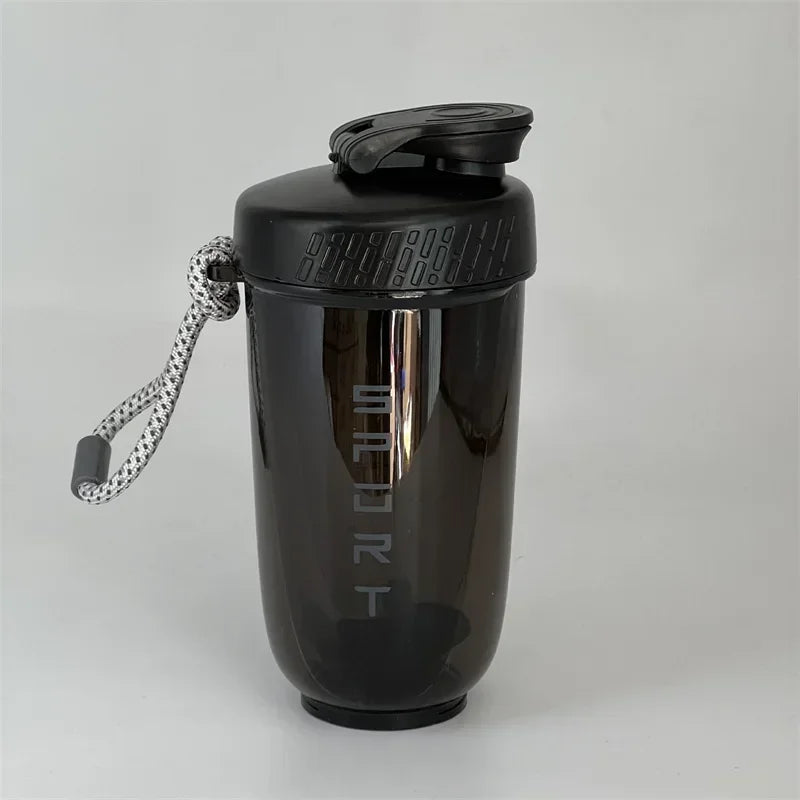 A black 600ml blender shaker bottle with a sports cap and a silver loop attached.