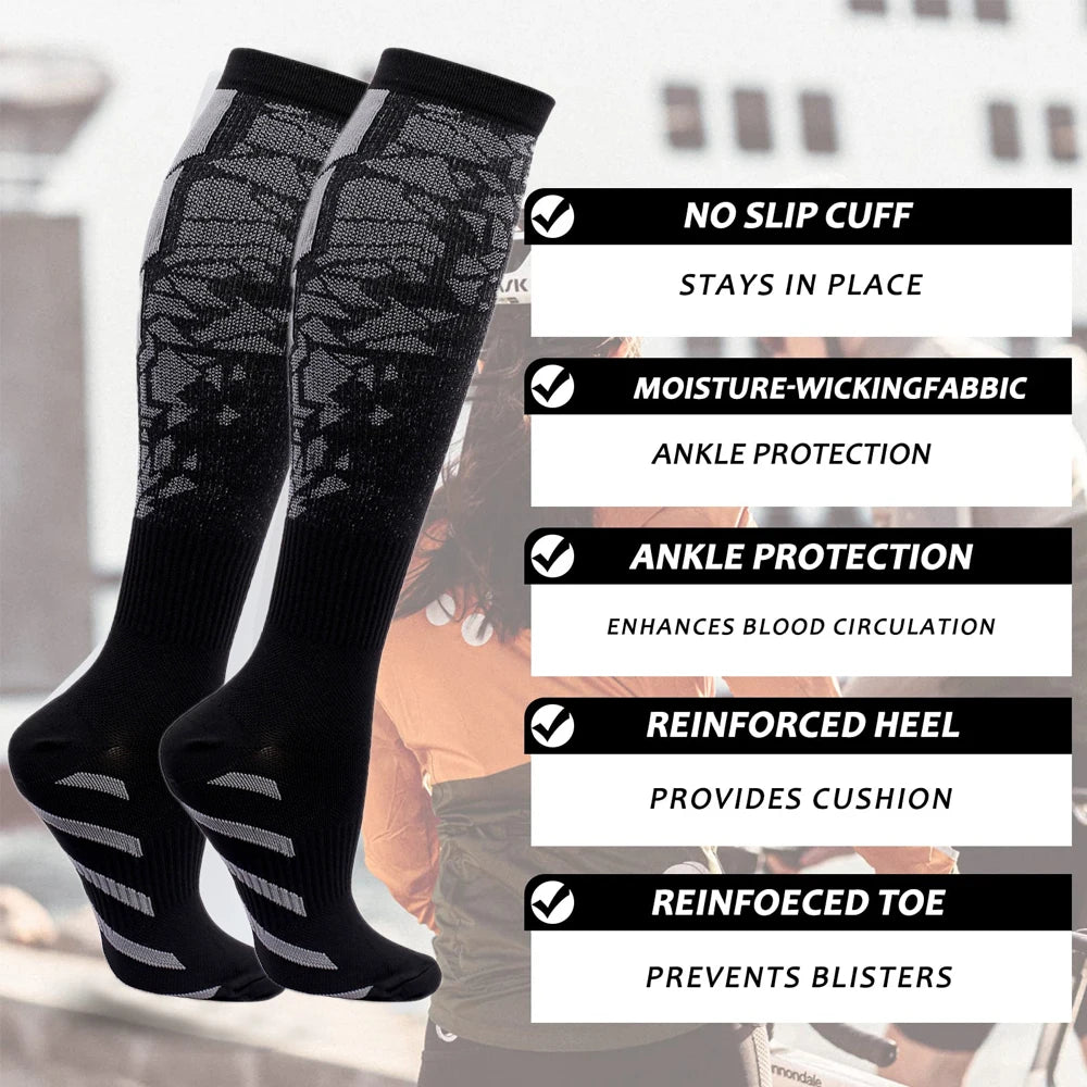 A pair of black and gray professional sports compression socks with reinforced heel and toe for ankle protection.
