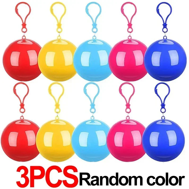 Three colorful disposable rain ponchos in red, yellow, and blue.