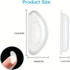 White silicone anti-slip eyeglass nose pads shown in various sizes and a hand for scale.