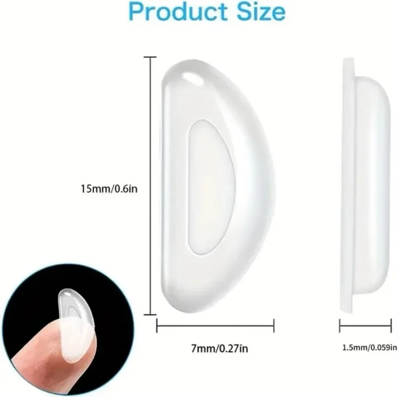 White silicone anti-slip eyeglass nose pads shown in various sizes and a hand for scale.