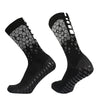 A pair of black honeycomb grip football socks shown from the side.