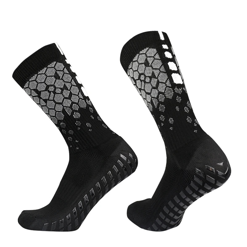A pair of black honeycomb grip football socks shown from the side.