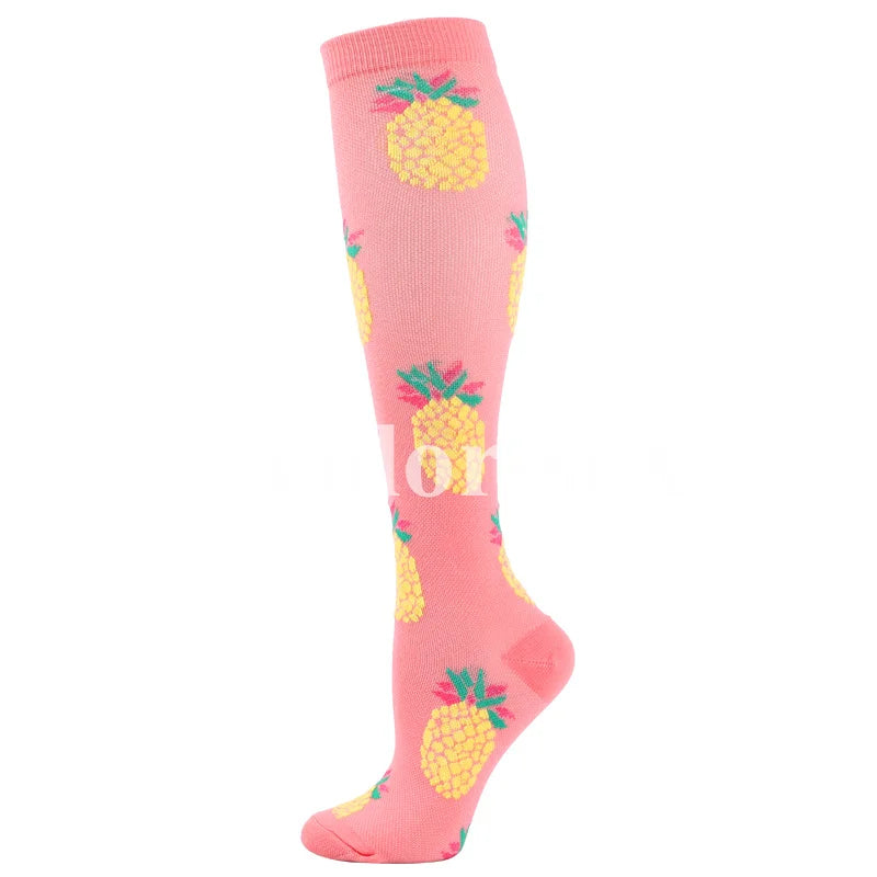 Pink compression socks with a yellow pineapple pattern