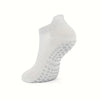 A white grip Pilates sock designed for yoga and barre, shown from the side.