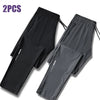 Two pairs of black and gray men's ice silk performance pants shown flat