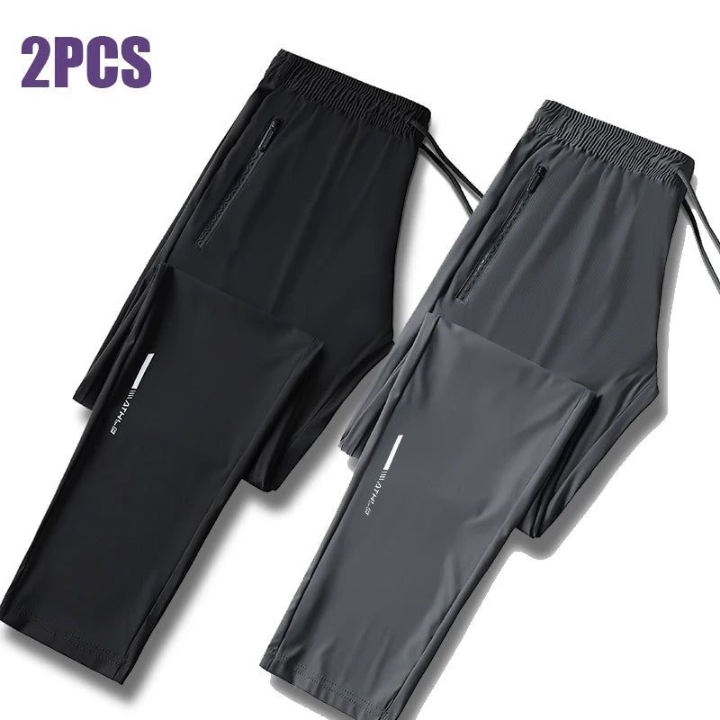 Two pairs of black and gray men's ice silk performance pants shown flat