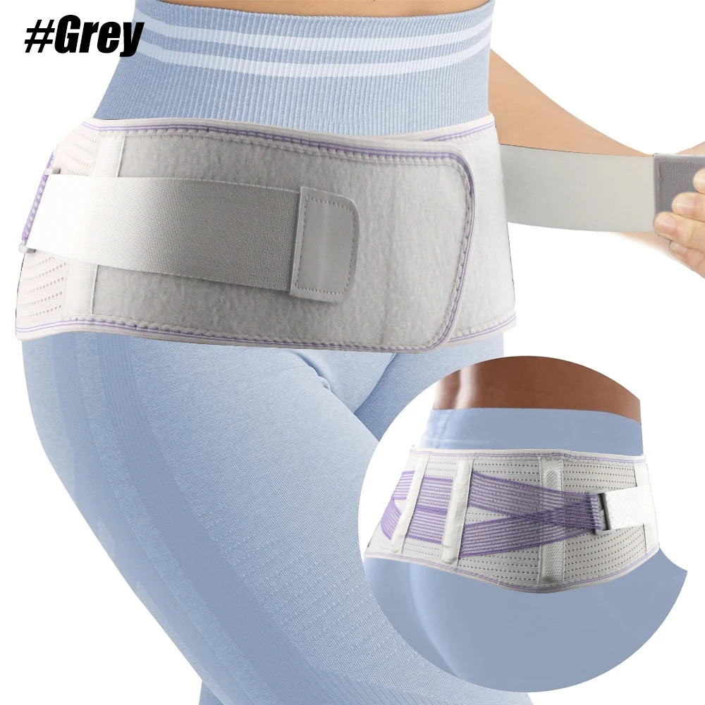 Ceinture de soutien grise réglable portée autour du bas de l'abdomen et de la taille d'une personne.