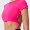 A bright pink women's fitness crop top yoga and gym t-shirt worn by a model.
