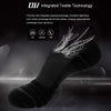A close-up view of a black athletic sock with fine fibers and threads, highlighting integrated textile technology.