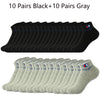 A collection of 10 pairs of black and 10 pairs of gray ankle socks laid out in rows.