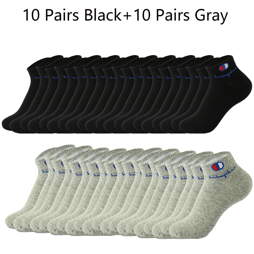 A collection of 10 pairs of black and 10 pairs of gray ankle socks laid out in rows.