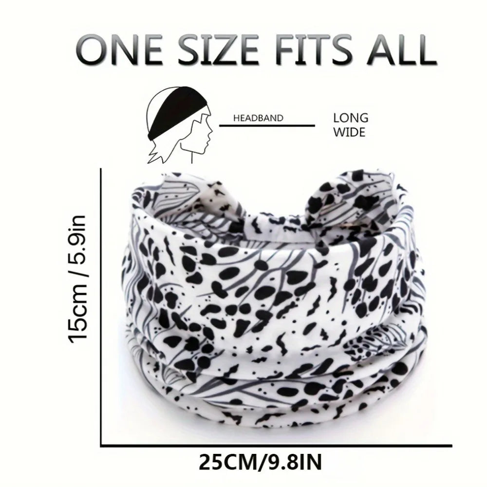 A black and white leopard print fabric headband shown rolled up.