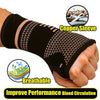 A hand wearing a black copper sleeve wrist compression brace, highlighting its breathable design for improved blood circulati