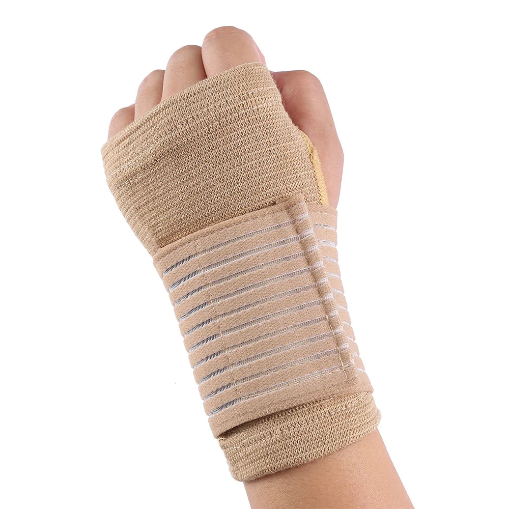 A hand wearing a beige elastic wrist support brace with striped detailing.