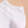 A close-up view of white comfort fit ankle socks folded or displayed against a light background.