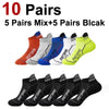 A collection of 10 pairs of sports socks in various colors and patterns, including red, gray, blue, white, and yellow.