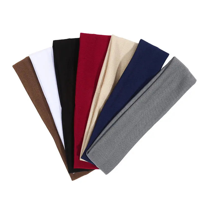 A set of solid elastic hair bands in various colors including black, white, maroon, beige, and navy blue.