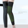 Black elastic knee sleeves with green dotted pattern for warmth and support