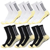 A set of white and black non-slip grip socks for sports, shown from the side.