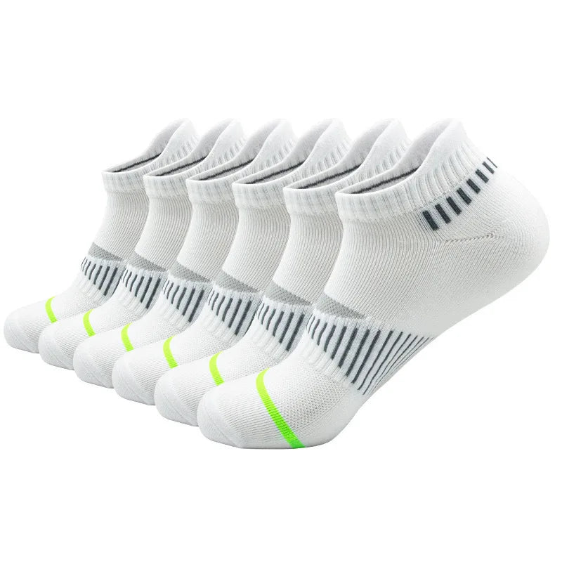 A row of white crew socks for men with black stripes and lime green accents.