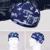 Casquette de bain en nylon élastique bleu foncé imprimée de silhouettes blanches de plantes et de faune tropicales.