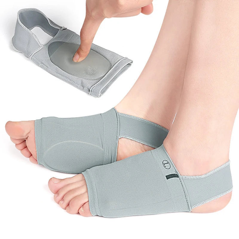 A hand is inserting a silicone arch support insole into a foot to provide comfort and arch support.