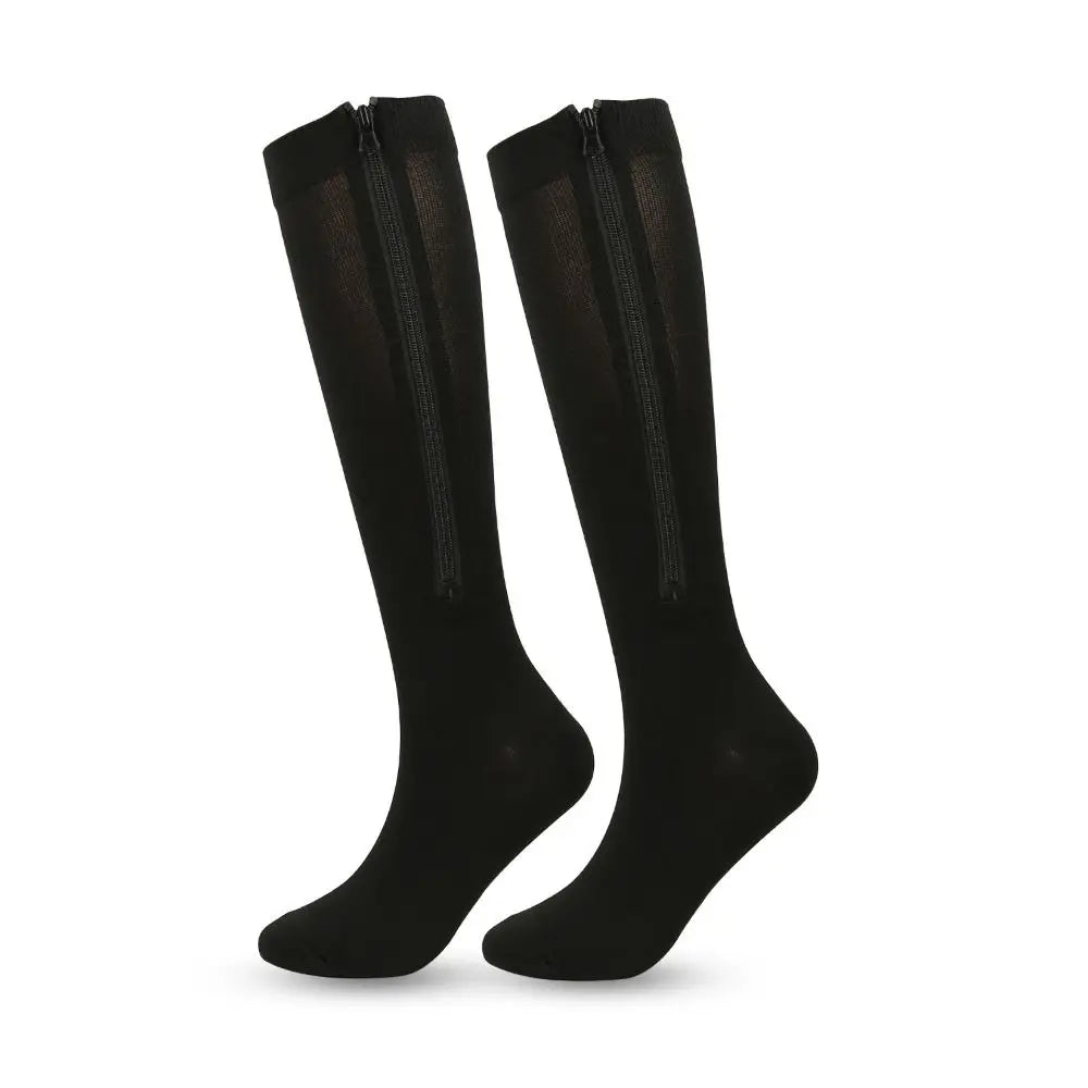 A pair of black high elasticity compression socks standing upright.